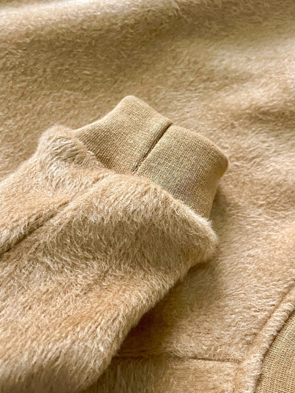 Close-up of beige fabric with a textured pattern