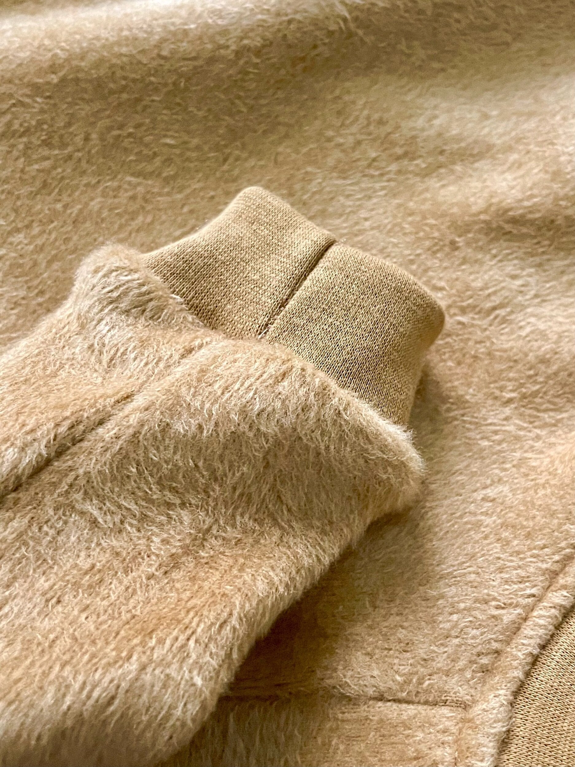 Close-up of beige fabric with a textured pattern