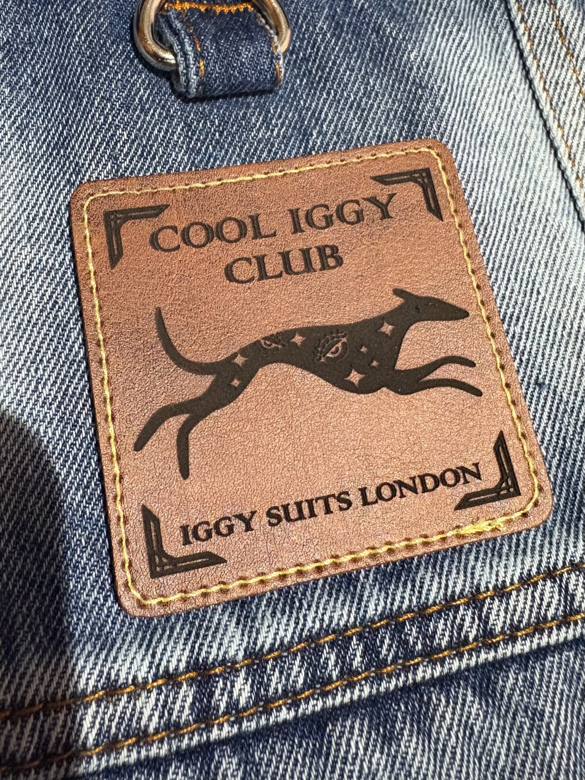 Patch with 'Cool Iggy Club' and 'Iggy Suits London' text on a denim background
