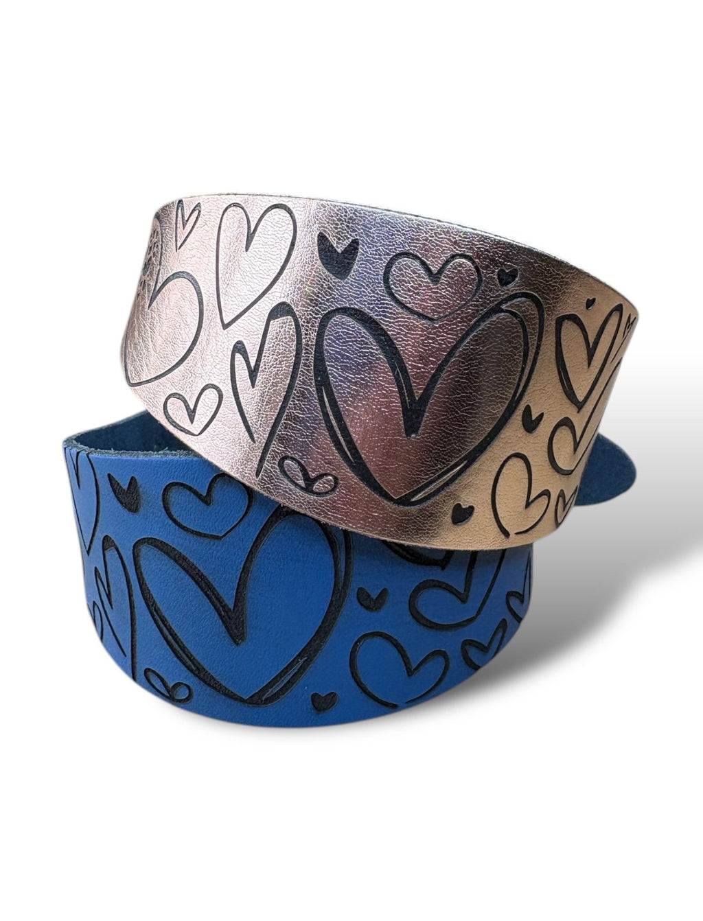 Two bracelets with heart designs on a white background
