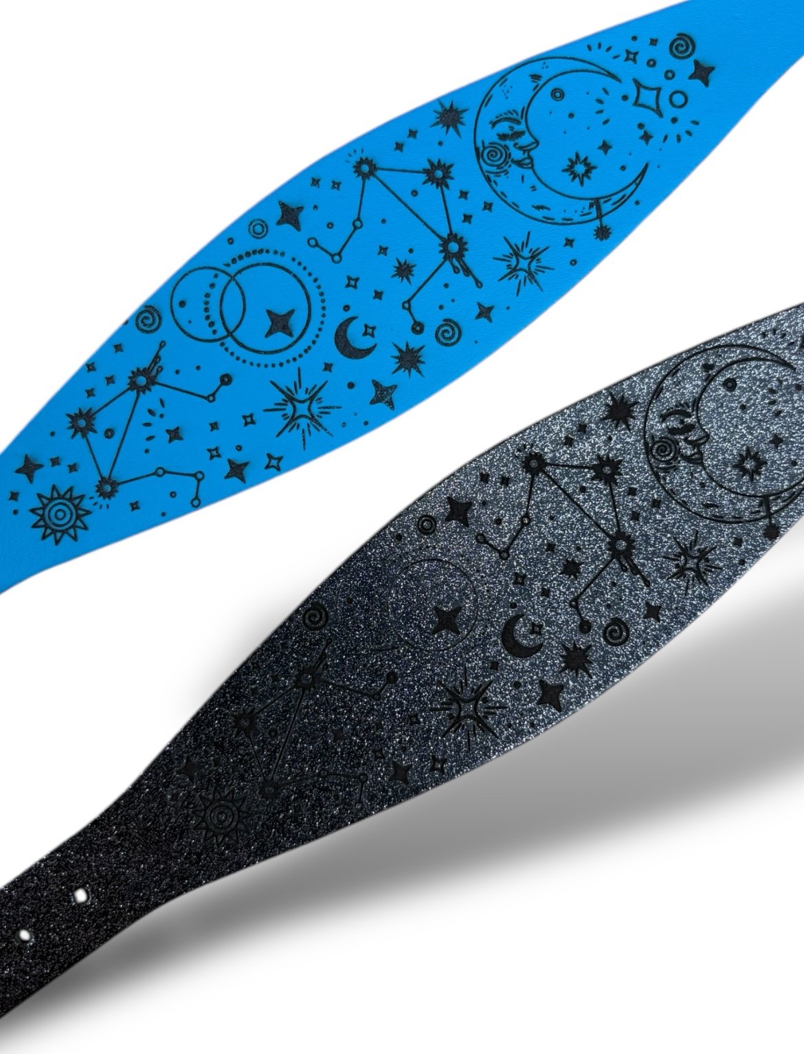 Black and blue paddle with celestial designs on a white background