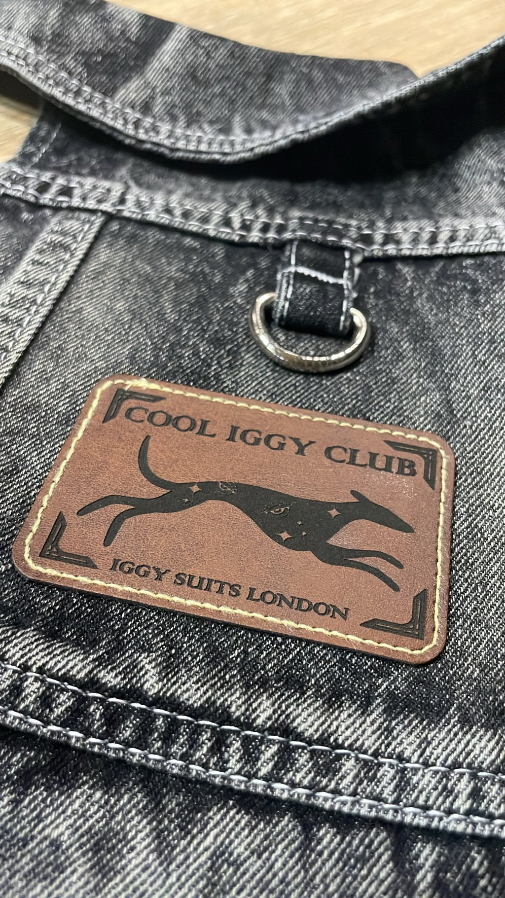 Denim jacket with a 'Cool Iggy Club' patch featuring a dog design.