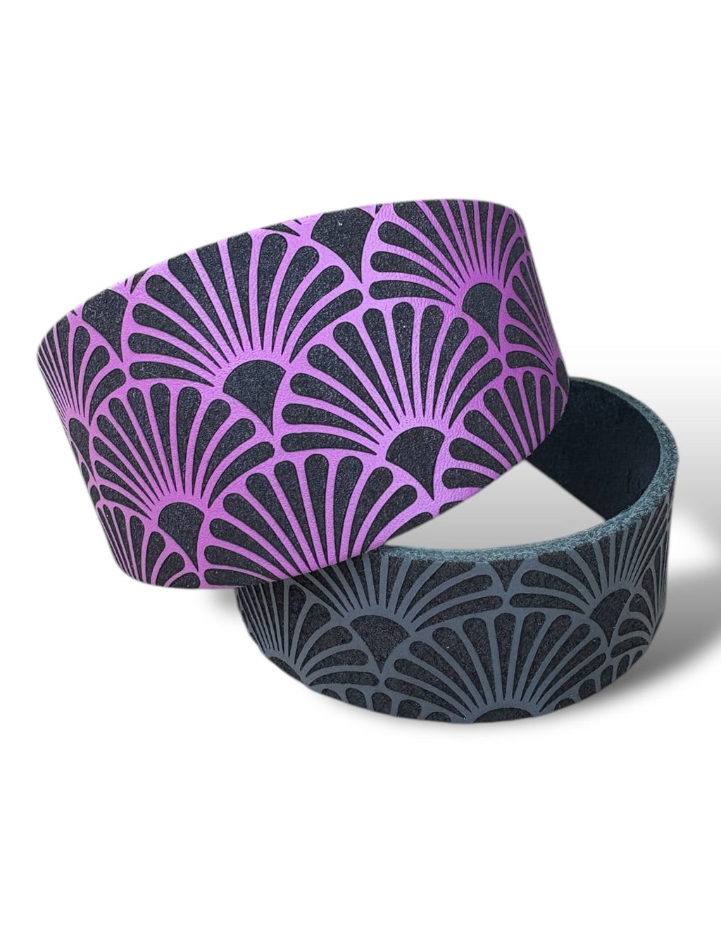Two circular containers with purple and black geometric pattern on a white background