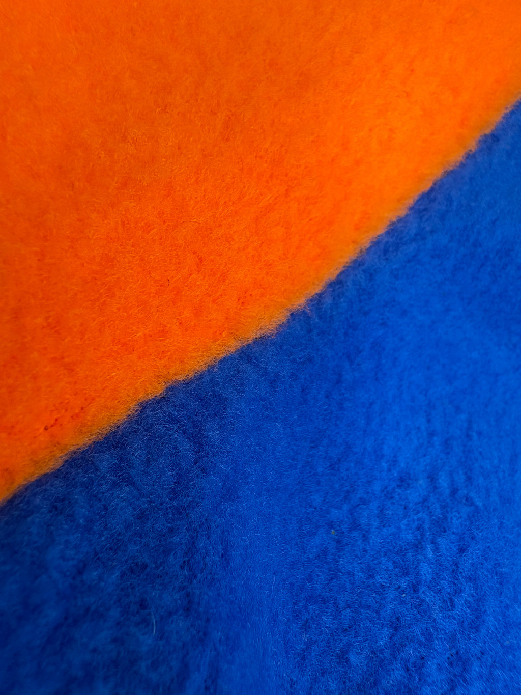 Close-up of orange and blue fabric texture