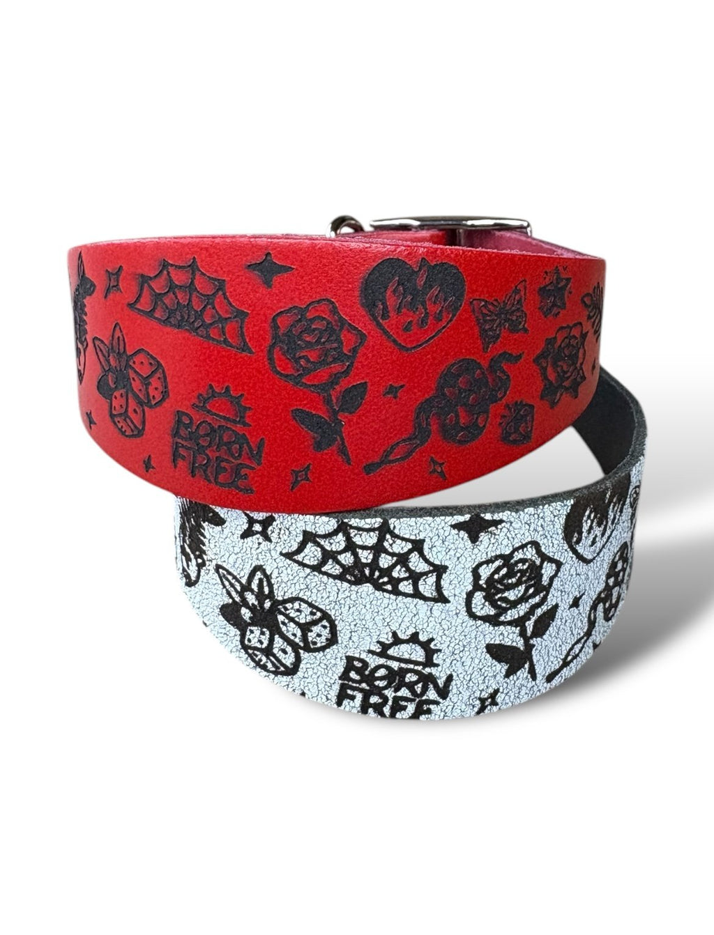 Two dog collars with black tattoo-style designs on a white background