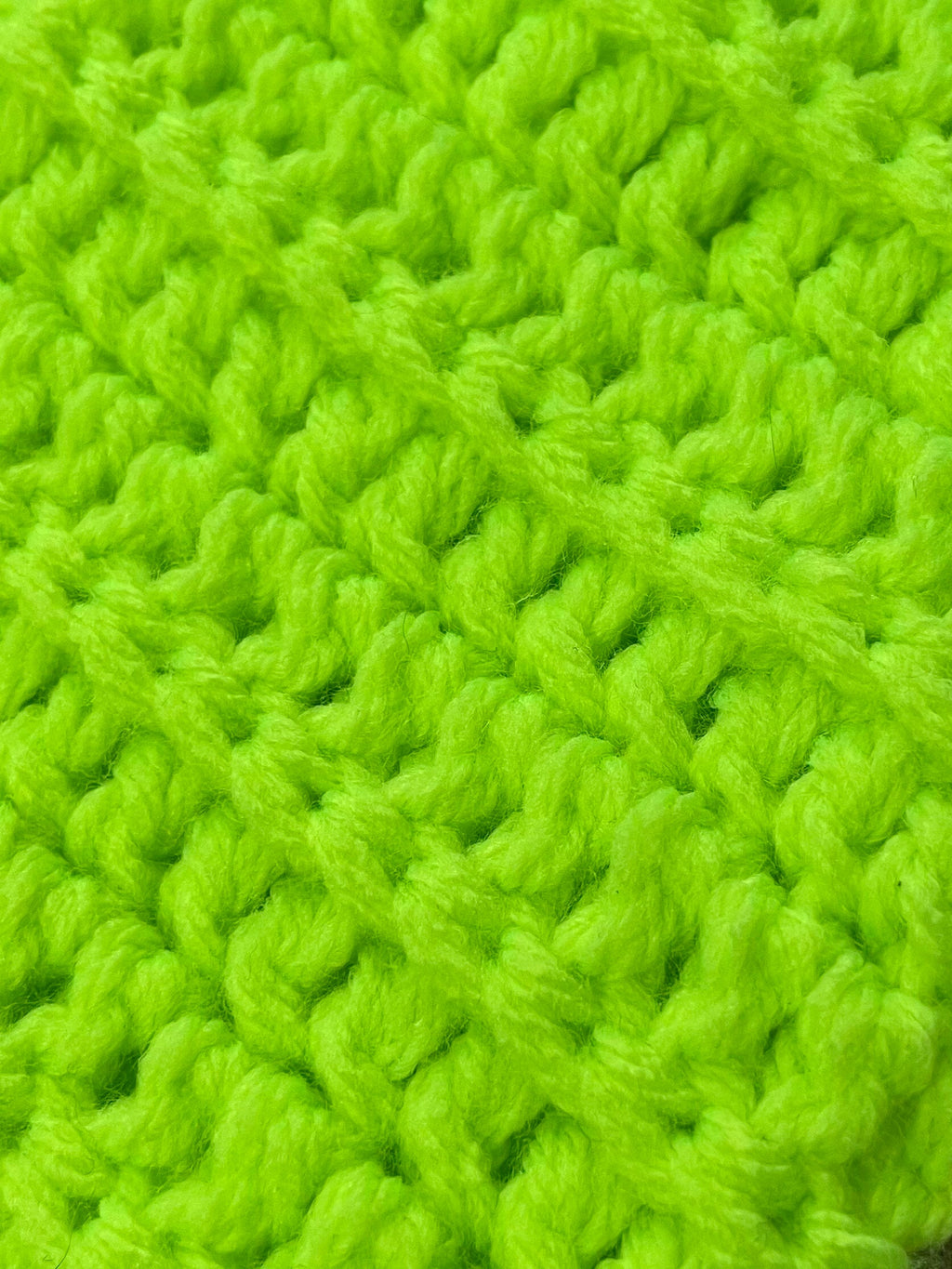 Close-up of bright green knitted fabric