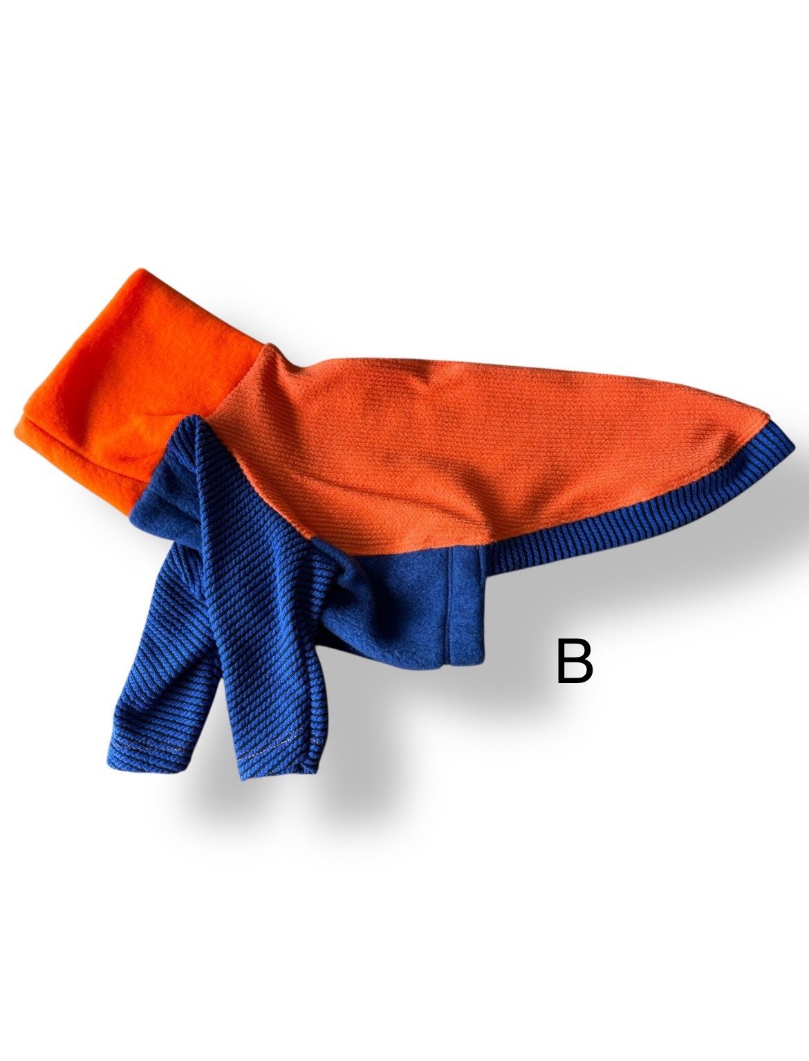 Orange and blue dog coat on a white background
