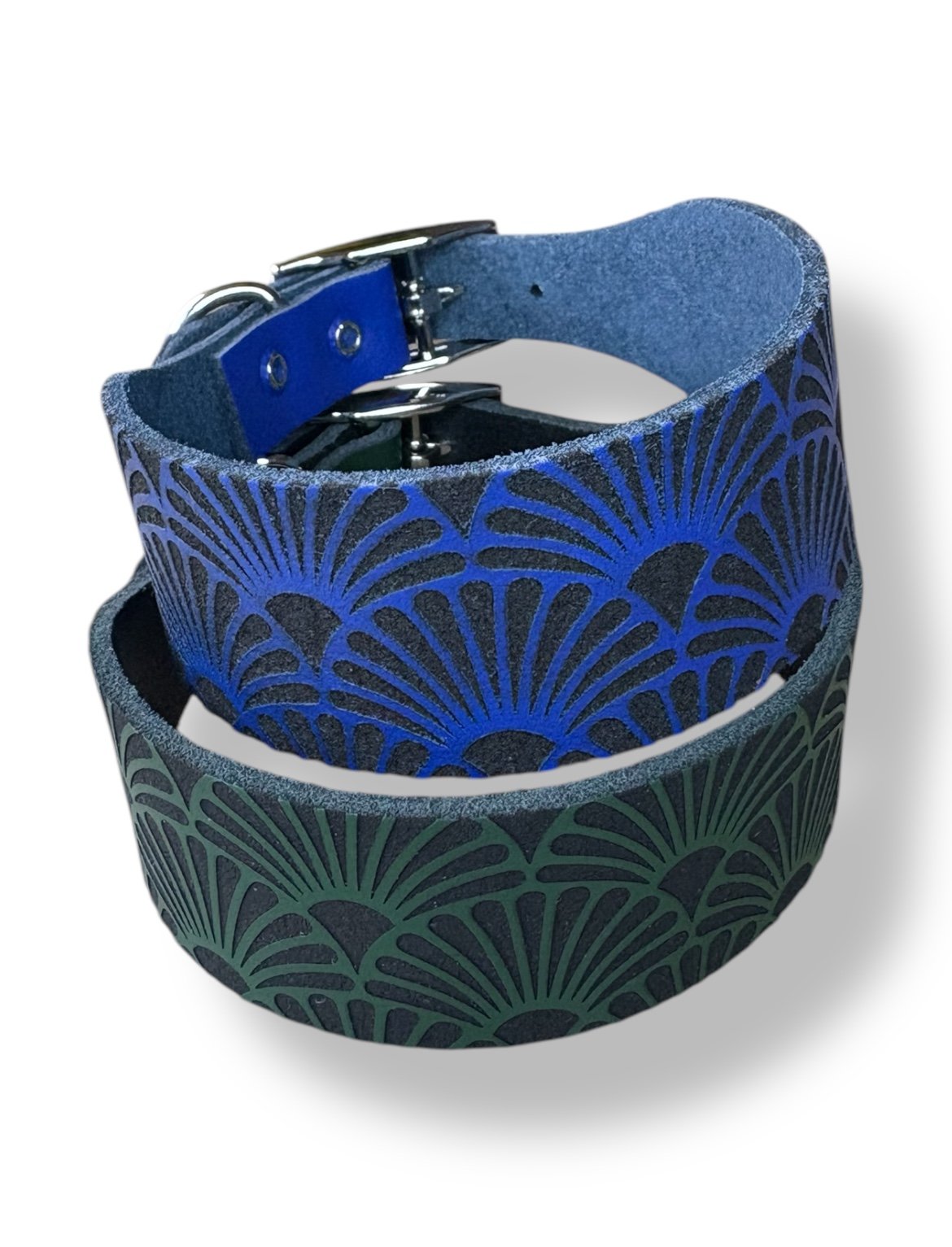 Two dog collars with blue and green pattern on a white background