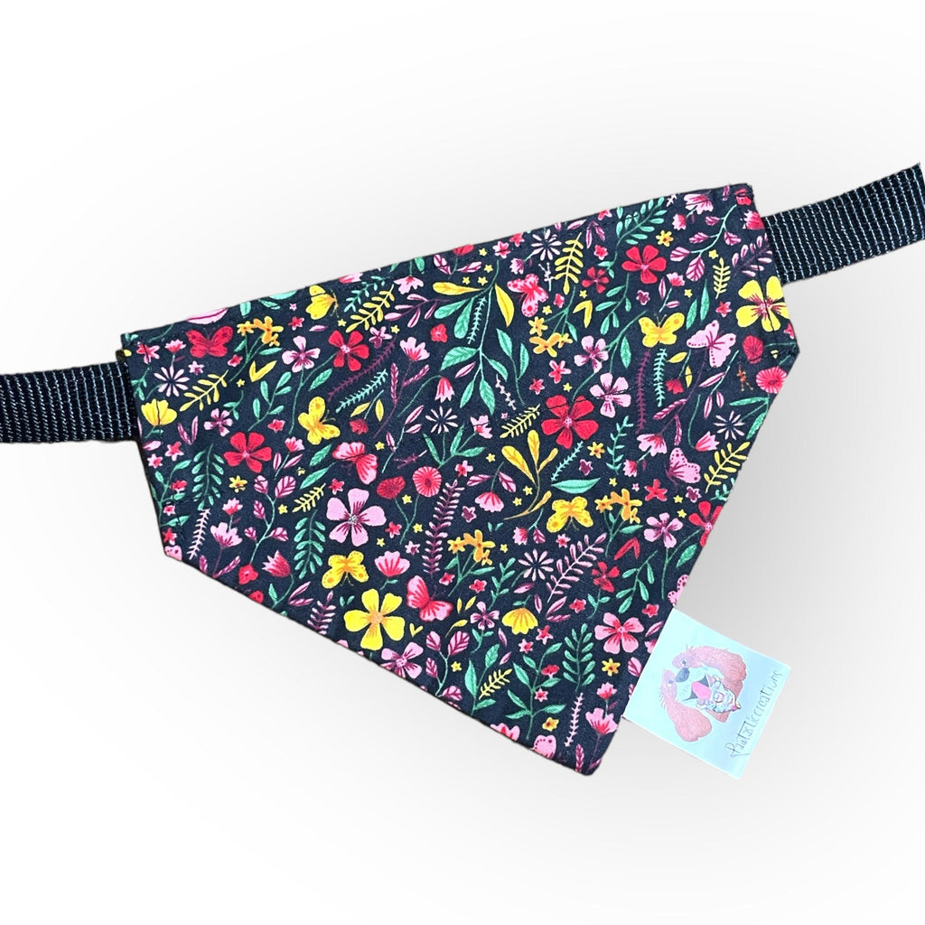 Floral patterned dog bandana with a visible brand tag on a white background