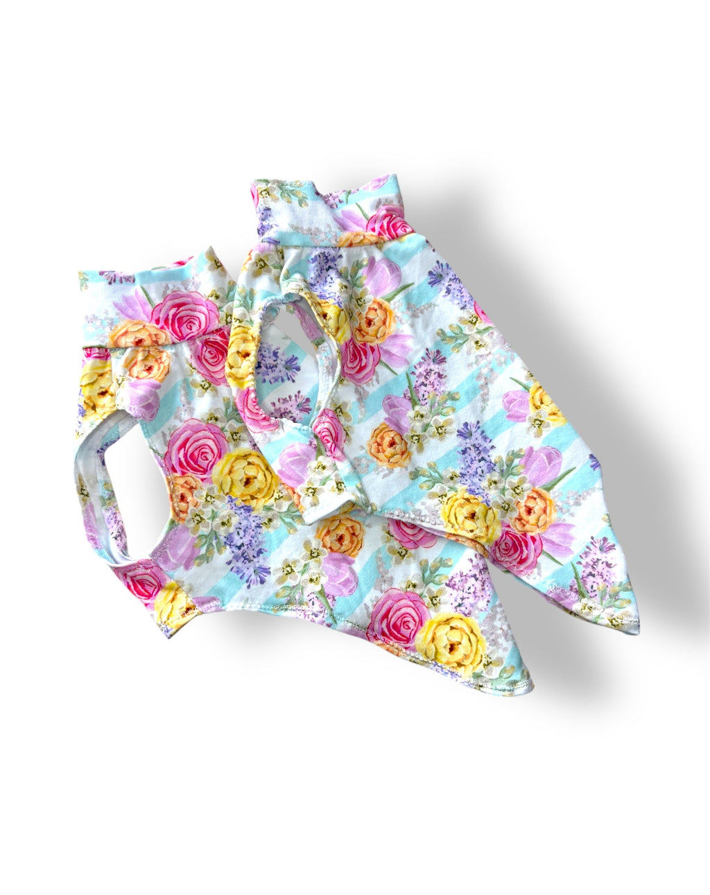 Floral-patterned dog dress on a white background