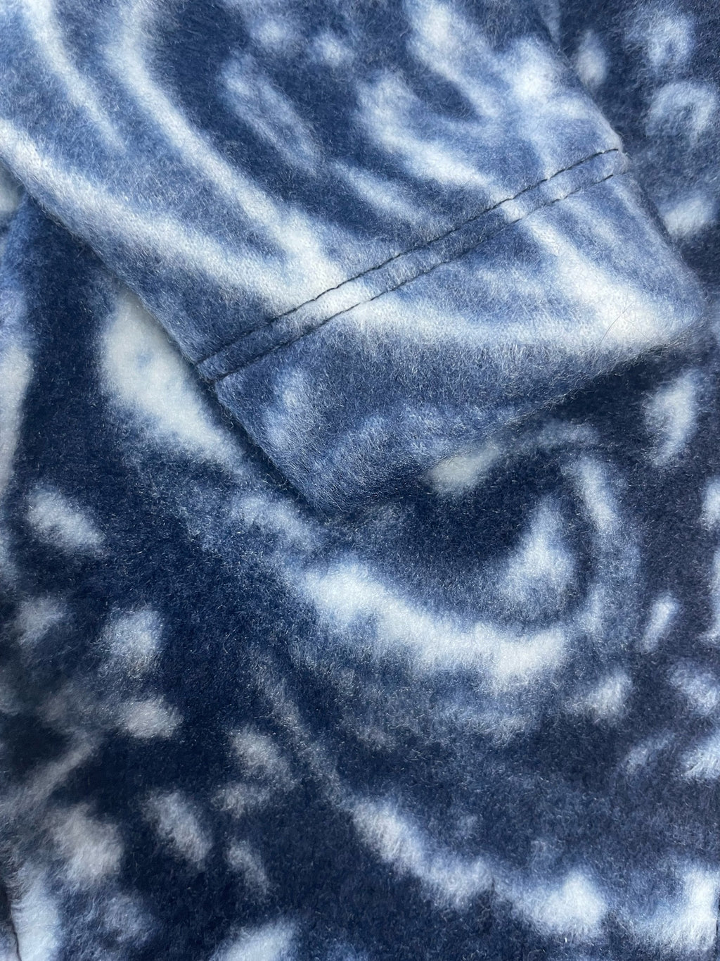 Close-up of blue fleece fabric with a pattern