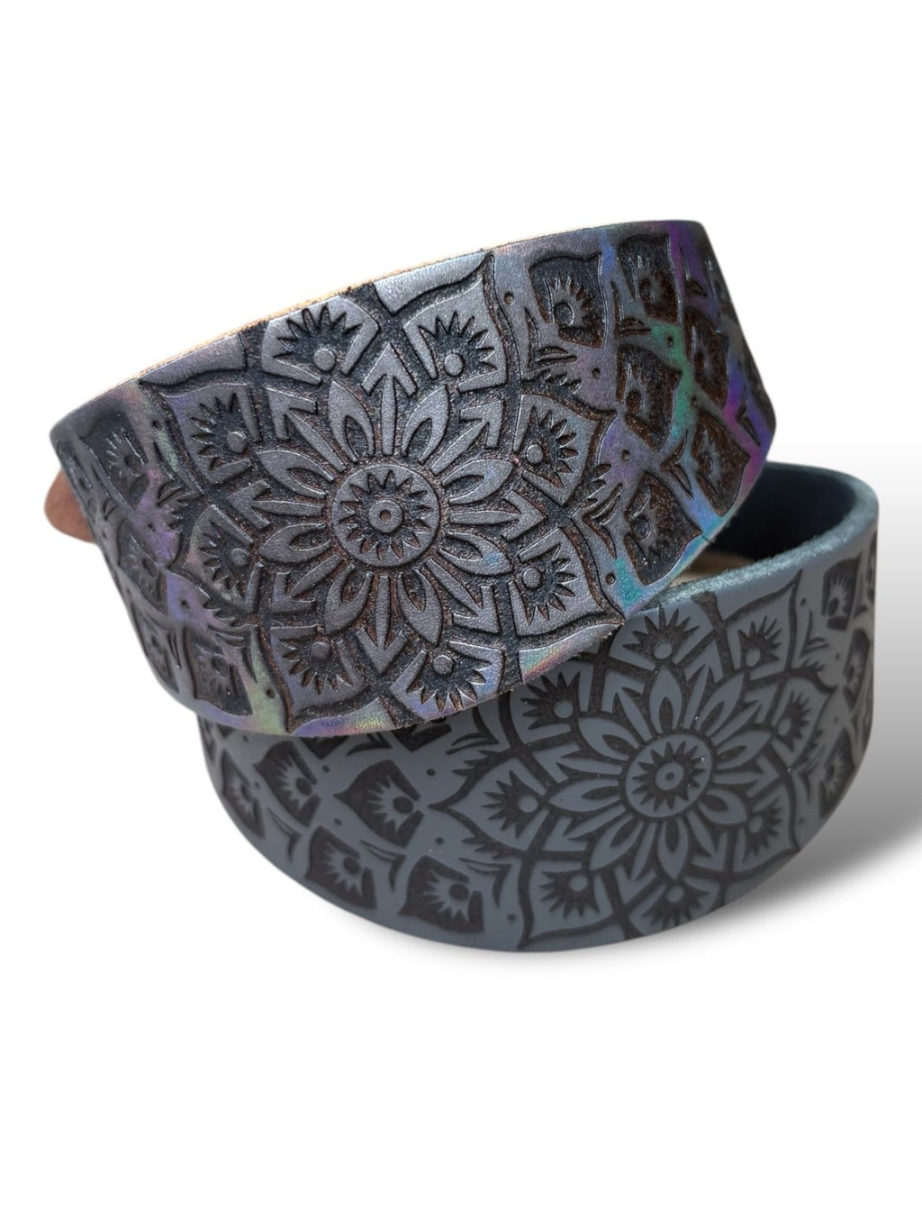 Black and gray patterned belt with a mandala design on a white background