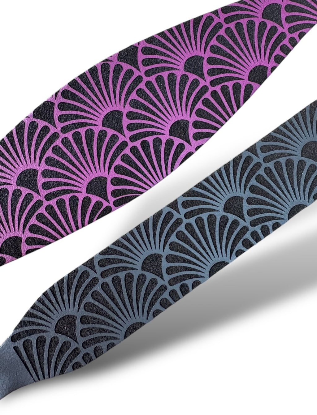 Two patterned straps, one purple and one blue, on a white background.