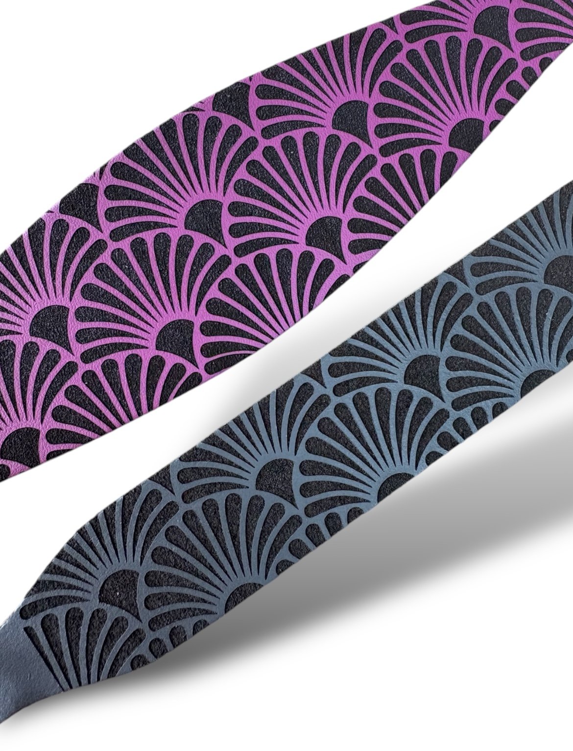 Two patterned straps, one purple and one blue, on a white background.