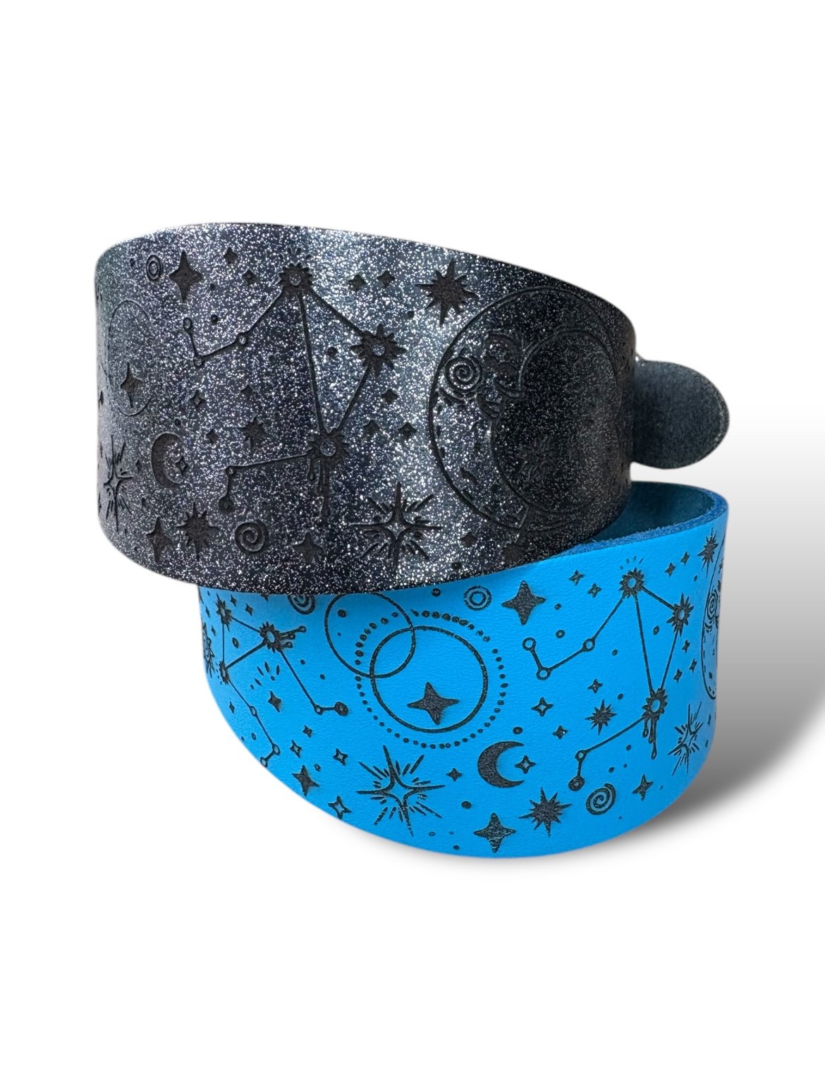 Two bracelets with celestial designs, one gray and one blue, on a white background.