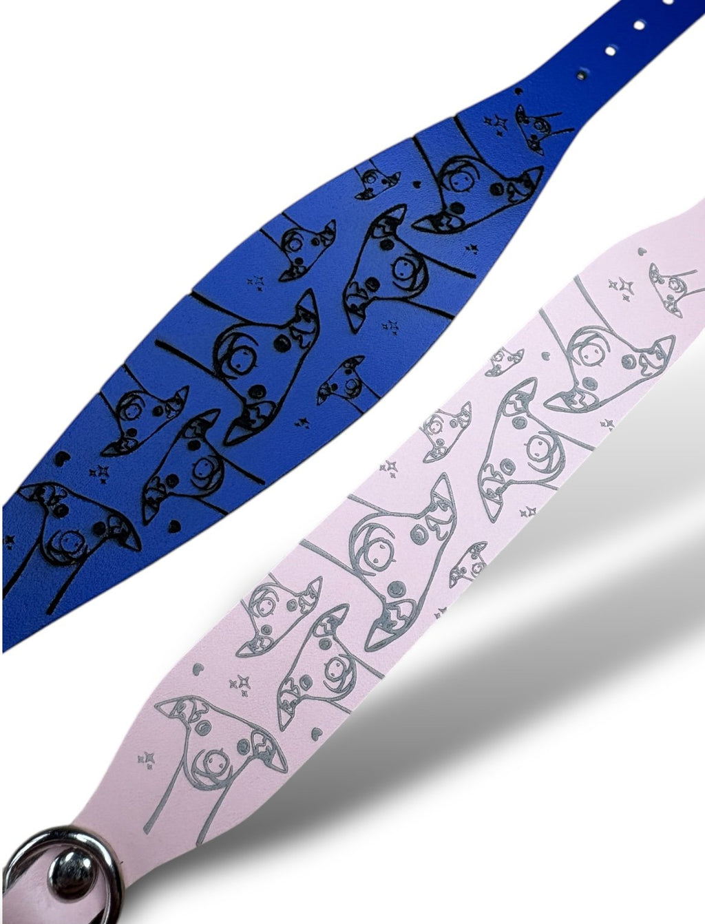 Two straps, one blue and one pink, with cat patterns on a white background.