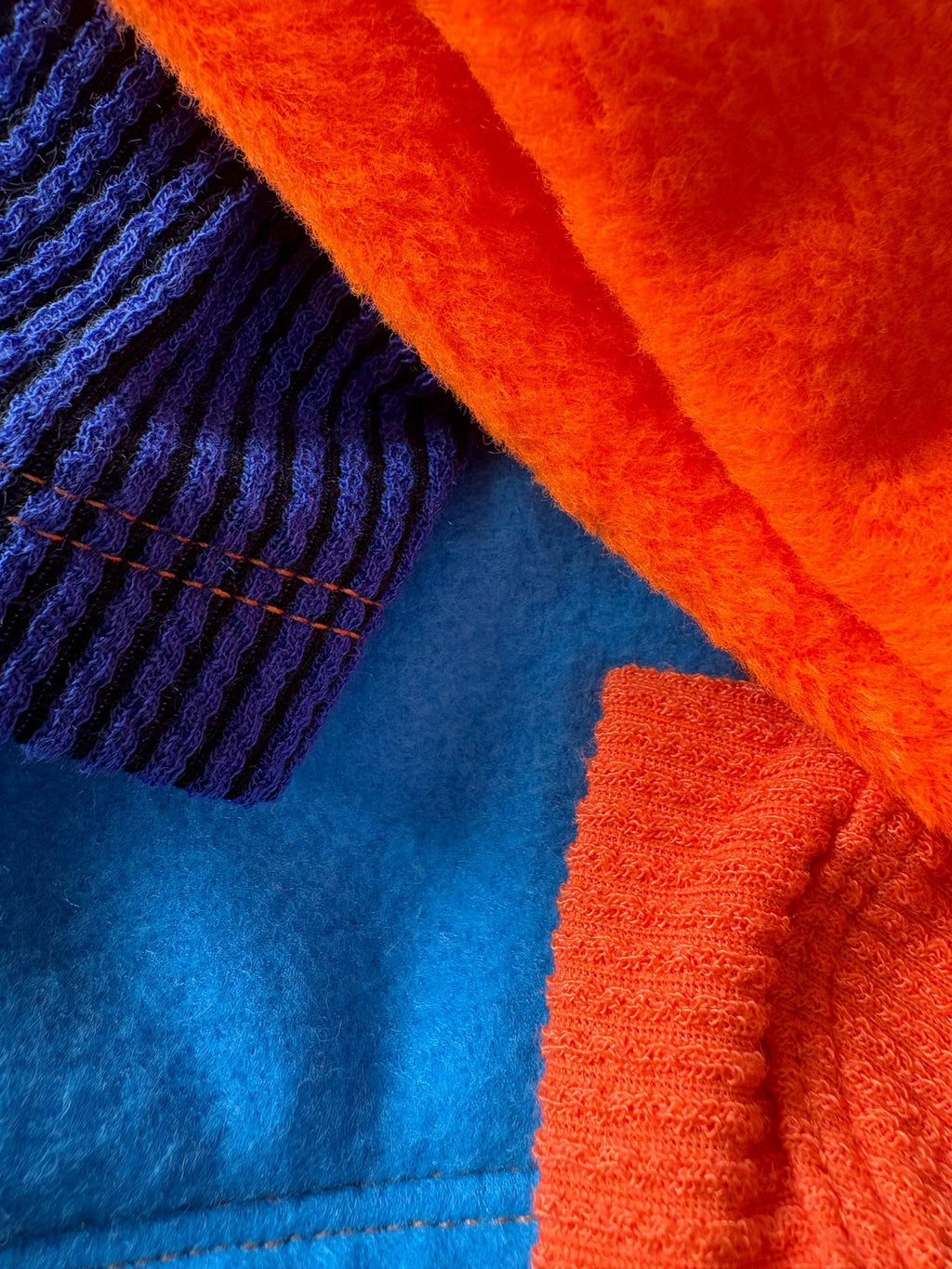 Close-up of orange and blue fabric textures