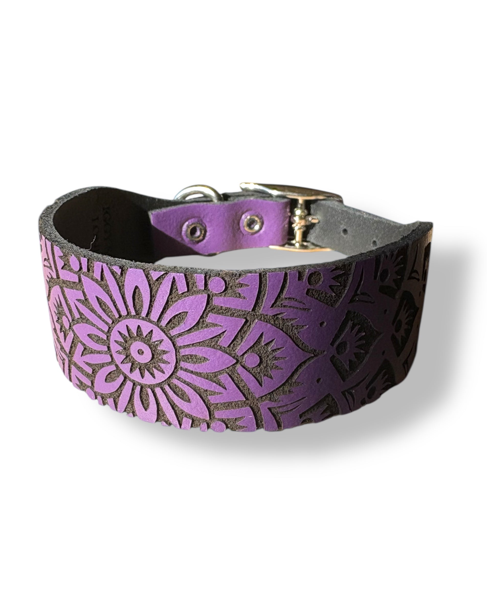 Purple leather collar with floral pattern on a white background