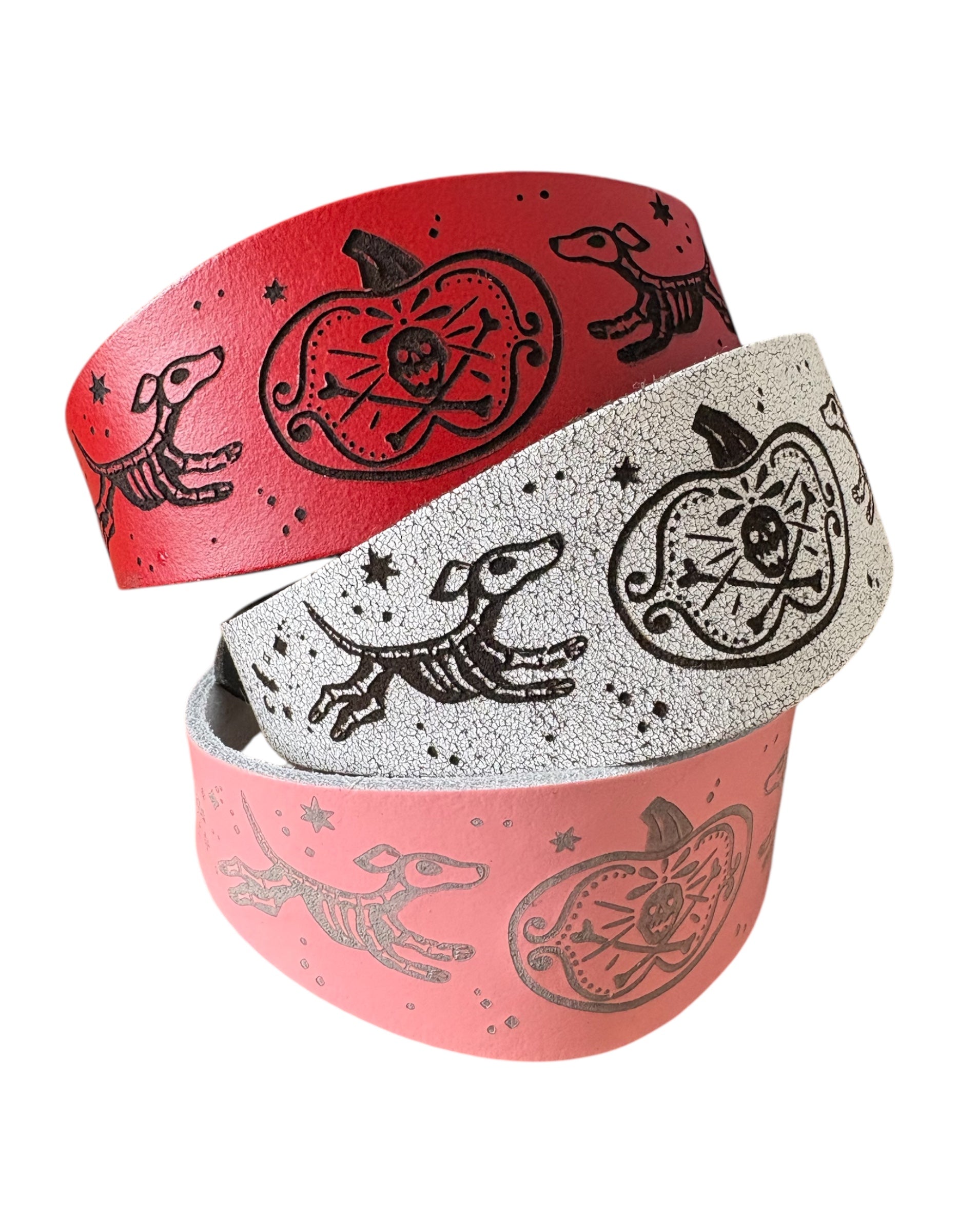 Two wristbands with black and white designs on a white background