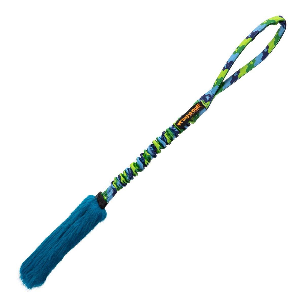 The Bright Fauxtastic Tug is a blue and green interactive dog toy with a handle, elastic bungee cord, and fluffy blue faux fur end, perfect for recall training and active games like tugging and fetching.