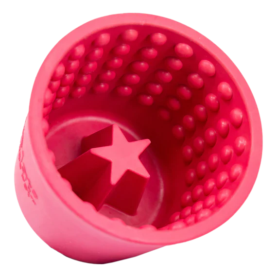 Pink textured ball with a star design on a white background