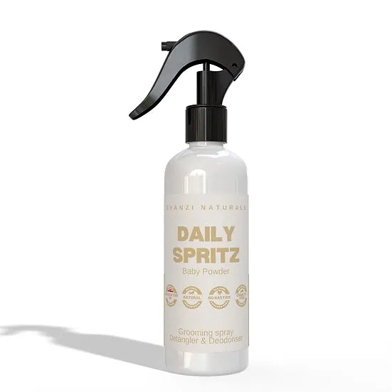 Clear spray bottle labeled 'Daily Spritz' on a white background