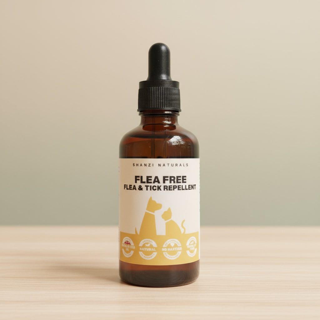 Bottle of 'Flea Free' flea and tick repellent on a wooden surface with a beige background