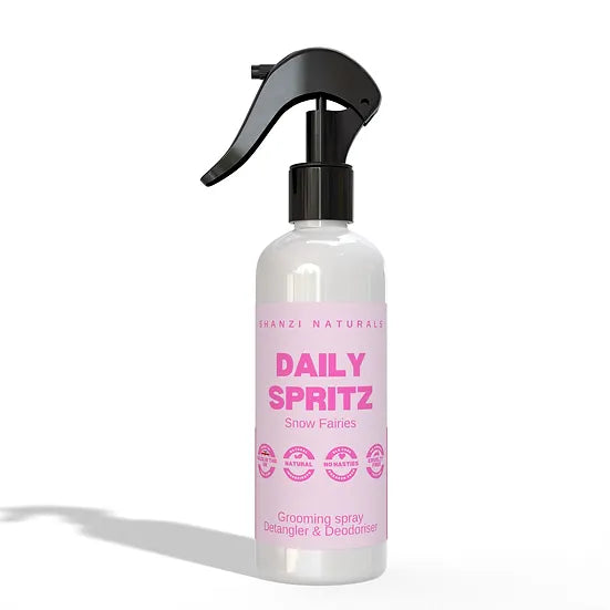 White spray bottle with pink label on a white background
